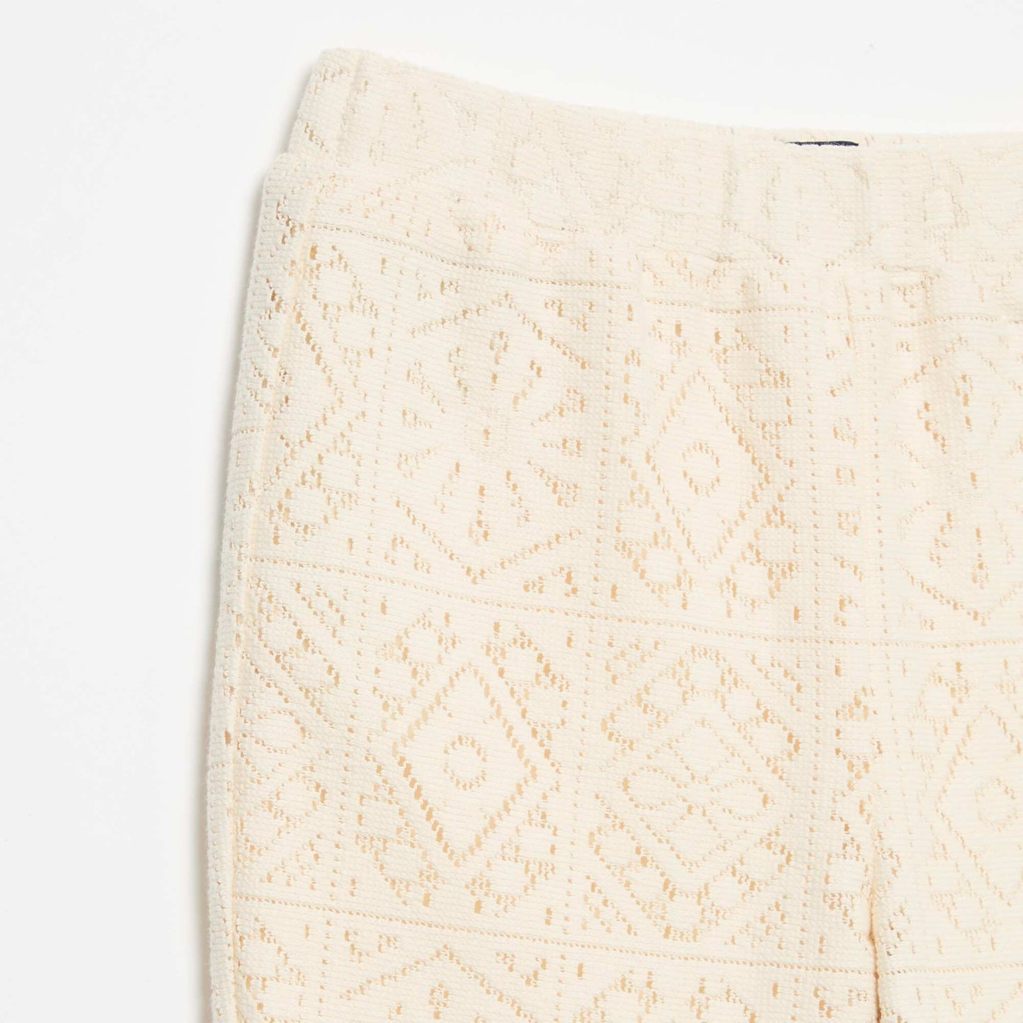 Crochet-look knit flare trousers BEIGE